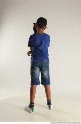 TIMBO STANDING POSE WITH GUN